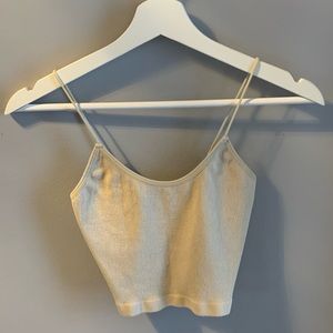 Beige ribbed thin strap tank top.